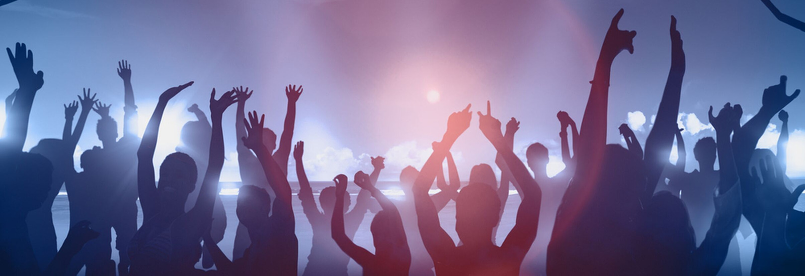 Silhouettes of people at a big party