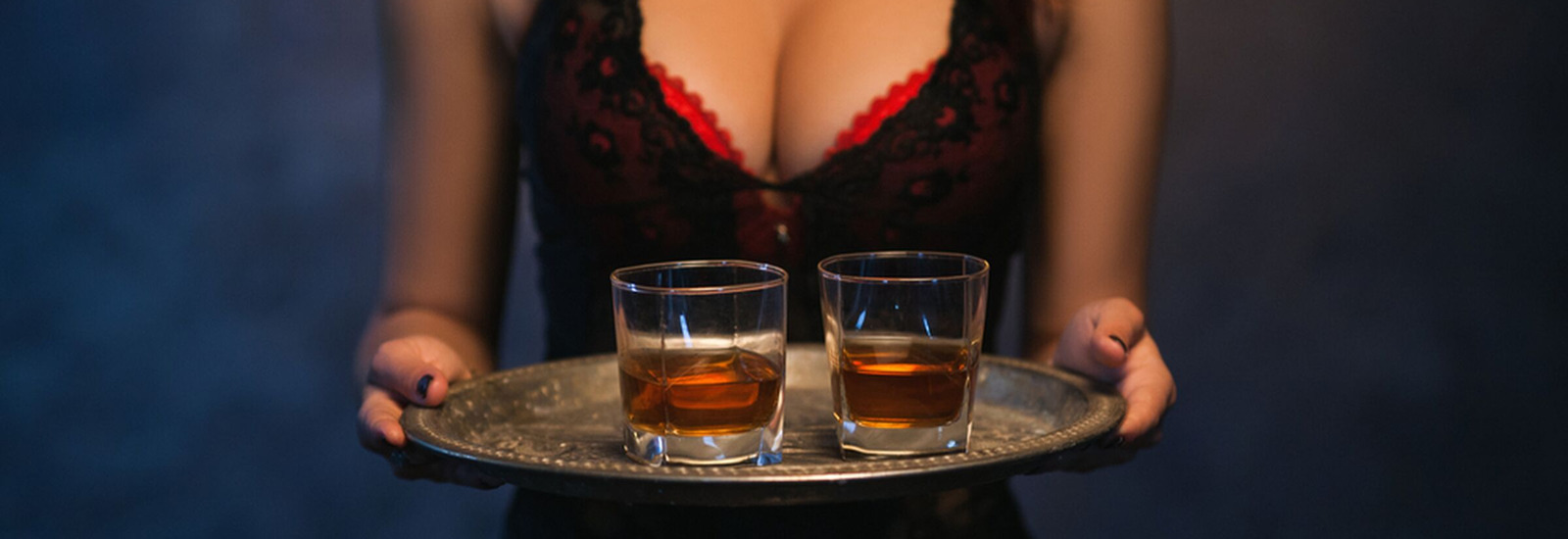 Woman serving 2 drinks on a platter